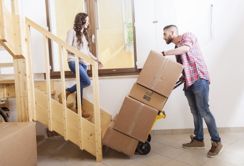 Professional movers packing boxes for a home move