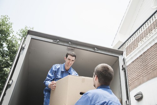 Professional movers loading items into a moving truck